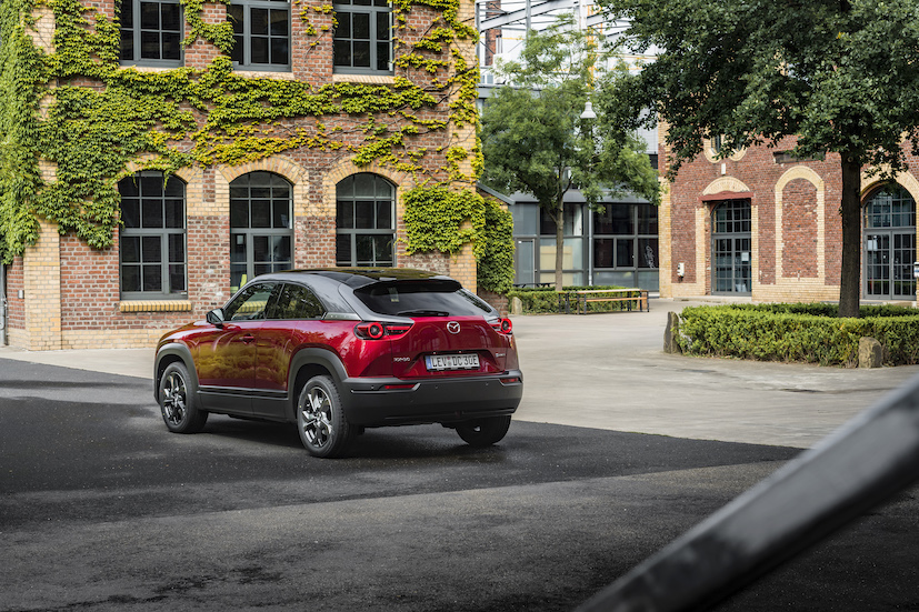 Red Mazda CX30 parked rear and left side